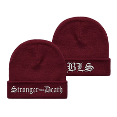 Two burgundy knit Stronger Than Death maroon beanies with white embroidery