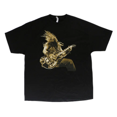 Black tee featuring a guitarist with long hair, inspired by Zakk Wylde’s electric guitar style